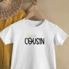 peux tu me faire un texte de vente de 300 mots pour cet article destiné pour annoncer une grossesse au travers des cousins et cousine via un t-shirt de couleur soit blanc soit noir , il me faut un titre en gras et 3 paragraphes stp
