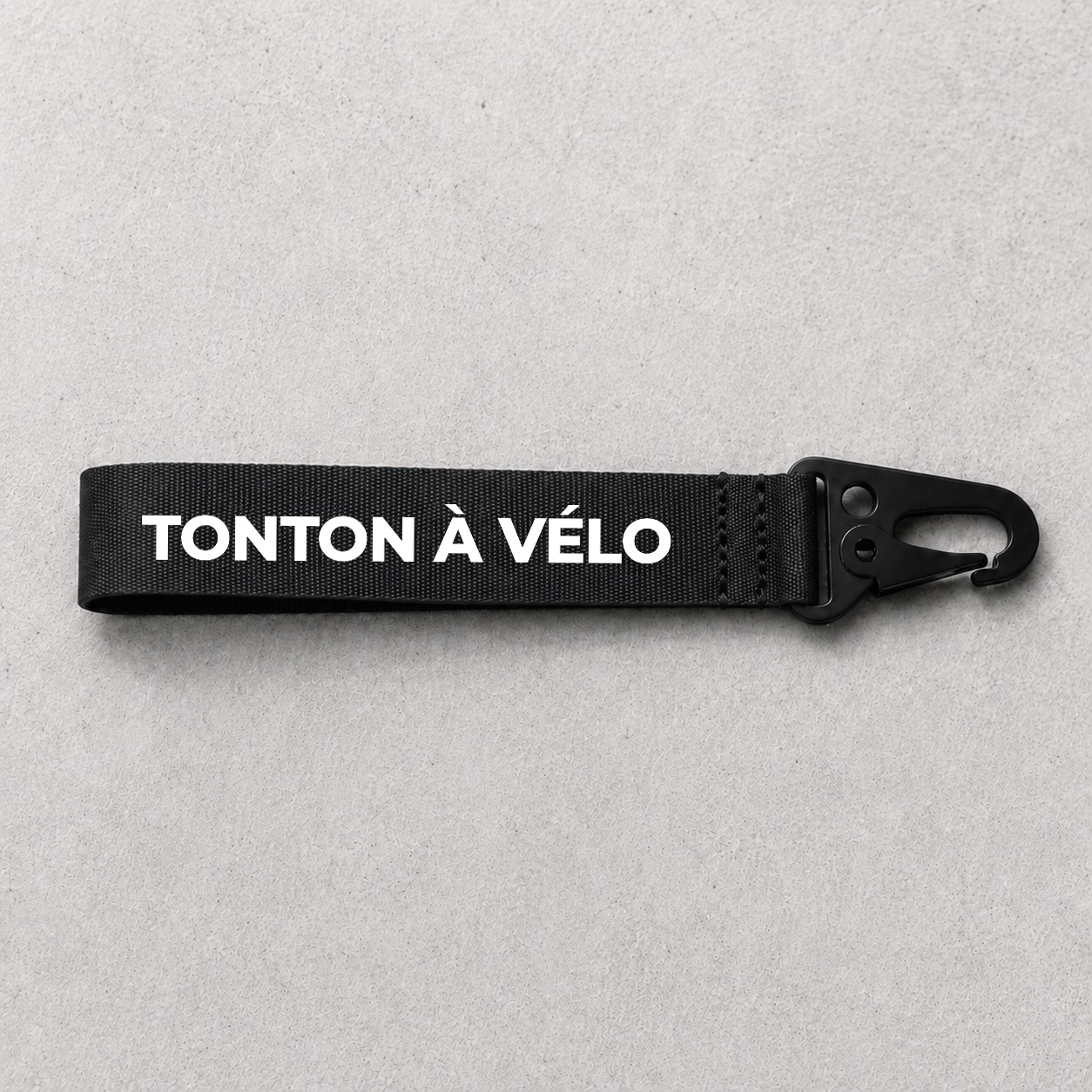 Porte-clé Tonton À vélo noir