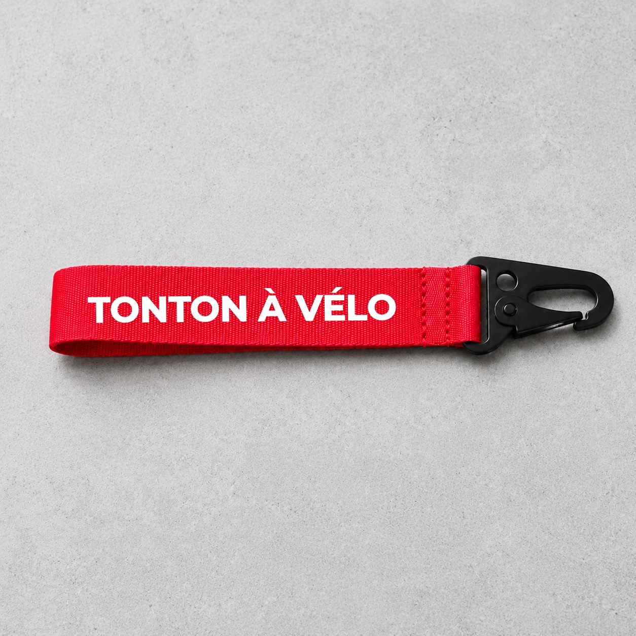 Porte-clé Tonton À vélo rouge